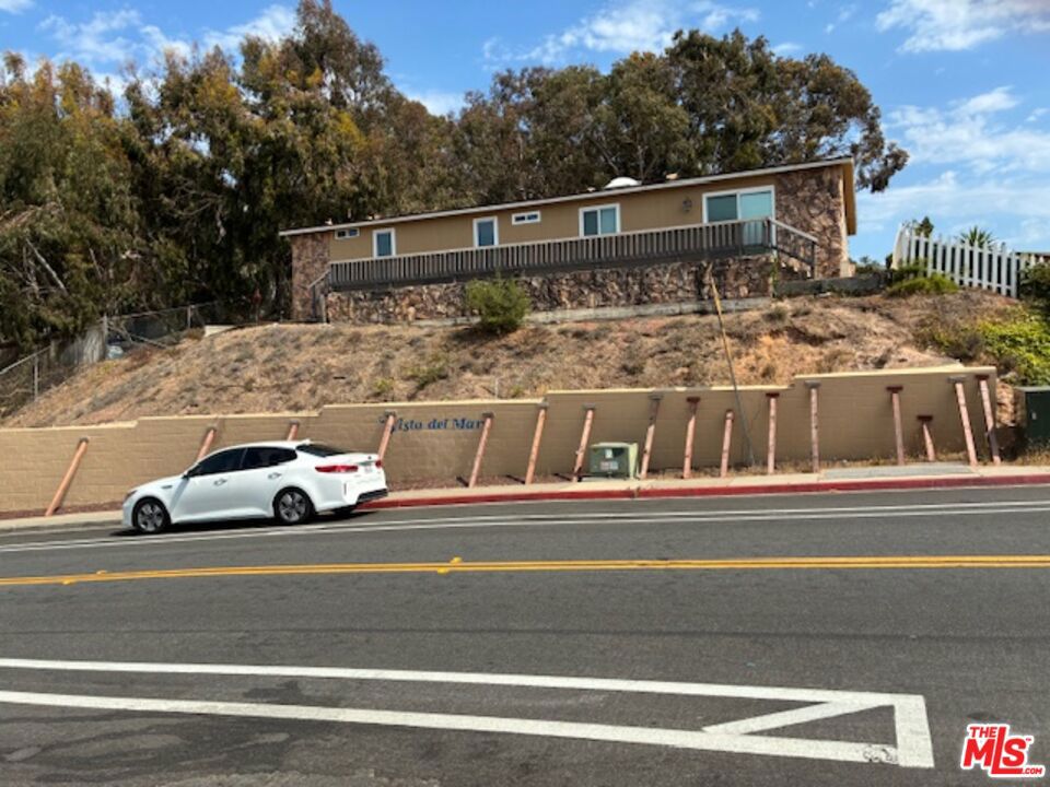 Great opportunity to own this property. It's a short sale & total fixer. The retaining wall needs to be replaced. Price negotiable.