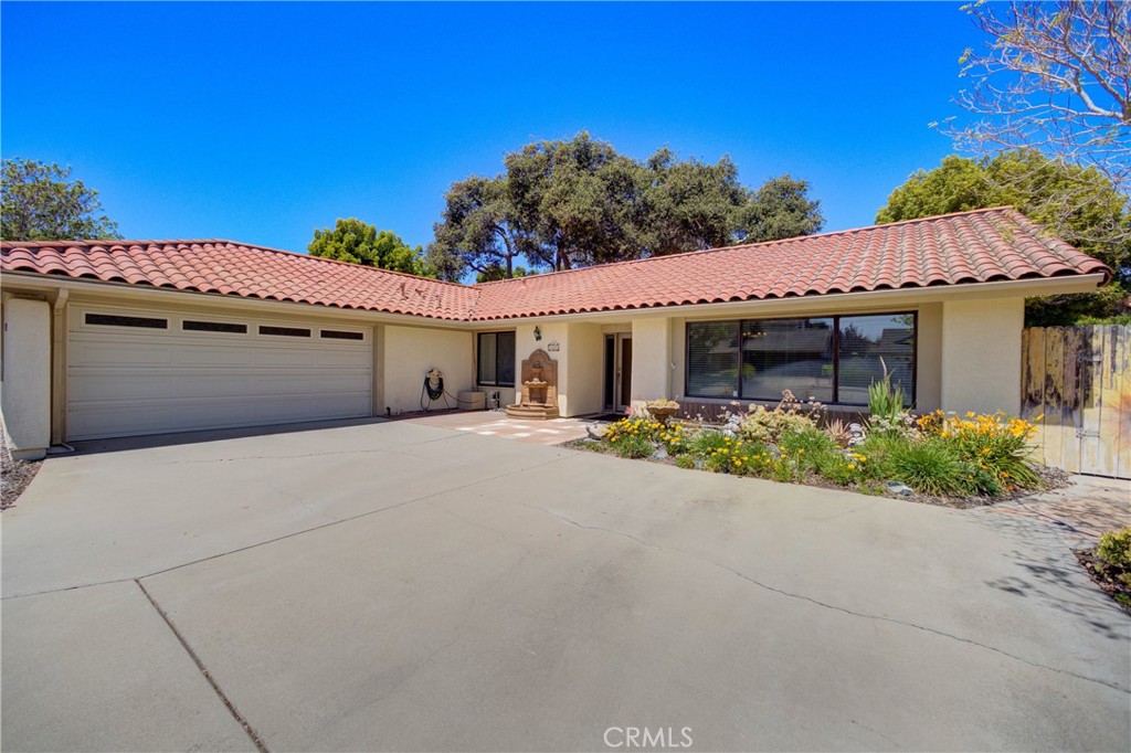 Nestled in the desirable Vandenberg Village neighborhood, this spacious single-level home offers 3 bedrooms, 2 bathrooms, and 1,806 sq ft of comfortable living space on a generous 7,841 sq ft lot. Built in 1984, this well-designed home features both style and functionality in a peaceful setting.
Step inside to discover a bright and airy living room with striking A-line ceilings and large windows that fill the space with natural light. The adjoining dining area creates an ideal layout for both everyday living and entertaining. A cozy family room with a fireplace invites you to relax and unwind, while a sliding glass door provides easy access to the backyard oasis.
The kitchen is quaint yet practical, offering plenty of cabinet space and a layout that keeps everything within reach. A hallway with built-in storage leads to the bedrooms, offering great organization and utility.
The primary suite is a true retreat with floor-to-ceiling windows, a walk-in closet, a private slider to the backyard, and a spacious en-suite bathroom with a walk-in shower and large vanity. Two additional bedrooms provide plenty of space for family, guests, or a home office—one even includes its own private slider to a secluded side yard, perfect for creating a tranquil outdoor escape.
Enjoy the convenience of an indoor laundry room with extra storage, and a large two-car garage equipped with built-in cabinetry for all your tools and gear.
Step outside into the low-maintenance backyard featuring beautiful pavers, mature trees, flowering plants, citrus trees, a charming swinging bench, and even a bird aviary—a wonderful space for both quiet moments and casual gatherings.
This is more than just a house—it's a place to call home. Don't miss your chance to make 4185 Vanguard Drive yours!