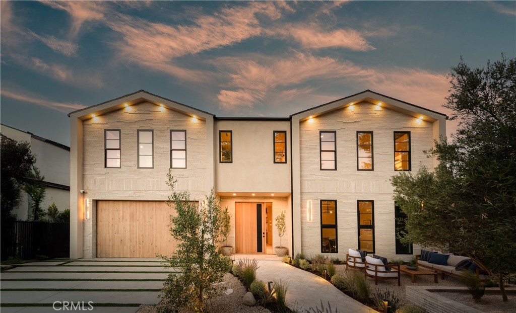 Experience elevated living in this striking new-construction estate with a detached ADU, set on an expansive gated lot in prime Studio City. Thoughtfully designed for modern living, the open-concept floor plan is complimented by high ceilings and wide plank engineered oak floors that run throughout the home. The designer chef’s kitchen is a culinary showpiece, equipped with top-of-the-line appliances, stunning Taj Mahal quartzite countertops and a massive waterfall island. The adjacent living room and formal dining area are anchored by an oversized sliding glass door that disappears into the wall for seamless indoor-outdoor living – perfect for entertaining. The main level also features a state-of-the-art media room, ensuite bedroom and chic powder bathroom. Upstairs, a flexible loft space, laundry room and four generously sized ensuite bedrooms await, including a luxe primary suite with a private balcony, custom walk-in closet and sumptuous bathroom, complete with a soaking tub, large rainfall shower, smart toilet, double vanity and makeup vanity. Step outside to a serene backyard retreat surrounded by privacy hedges, where you’ll find a sparkling saltwater pool/spa, outdoor kitchen and low maintenance artificial turf yard. The detached ADU offers endless possibilities with a spacious living/dining area, full kitchen, bedroom and bathroom – great for guests, in-laws, a home office or wellness space. Additional highlights include a Control4 smart home system with integrated speakers and security cameras, a central vacuum system, paid-off solar panels and a two-car garage that's been prewired for an EV charger. This property is ideally located within the highly acclaimed Dixie Canyon School District and nearby Ventura Boulevard’s vibrant shopping and dining scene, the Shops at Sportsman Lodge and so much more.