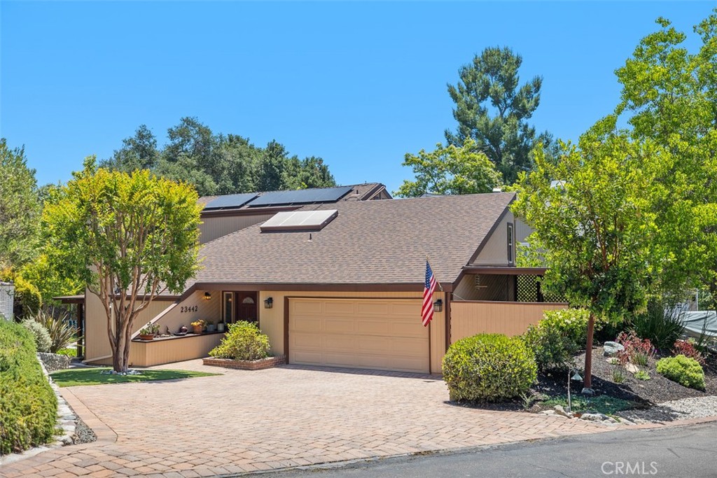 $55,000.00 Price Adjustment! Imagine coming home to a serene retreat nestled behind the gates of Coto de Caza, in the charming community of The Village. This custom 4-bedroom, 3-bathroom home is tucked away on a peaceful cul-de-sac, surrounded by the lush greenbelt and majestic oak trees that make this setting truly spectacular. As you step inside, you’re greeted by soaring cathedral ceilings, abundant natural light, and a striking brick and wood fireplace anchoring the spacious living room. Expansive windows and glass doors frame stunning views of the rolling hills, creating a seamless connection to the outdoors. The backyard is your private sanctuary; quiet, tranquil, and perfect for peaceful evenings or lively gatherings with friends. You’ll love unwinding here, whether it’s stargazing with a glass of wine or soaking in the hot tub. Imagine preparing meals in the gorgeous kitchen, where stainless steel appliances, warm maple cabinetry, and a center island make every moment a joy. The kitchen flows effortlessly into the dining room, with views of the tranquil backyard that invite you to linger. The cozy breakfast nook, with direct access to a private patio, is the ideal spot for savoring your morning coffee. The primary suite will feel like your personal retreat, with its high-vaulted wood beamed ceilings, walk-in closet, and sliding glass doors that open to the backyard. The spa inspired primary bathroom offers daily luxury with its walk-in shower finished in elegant granite and tile. Upstairs, three additional bedrooms offer plenty of space for family, guests, or a home office, ensuring everyone has their own comfortable corner. This home is move-in ready, featuring fresh interior paint, a brand-new AC system, and leased solar for energy efficiency. A side storage shed, whole-house attic fan, custom fire prevention manual roof sprinkler system, brick paved driveway, and low-maintenance custom turf make life here effortless, giving you more time to enjoy the things that matter most. Living in Coto de Caza means embracing a vibrant lifestyle, with access to award-winning schools, a prestigious golf and racquet club (membership required), sports parks, and endless hiking, biking, and equestrian trails. With low HOA fees and no Mello-Roos, this community offers incredible value for its unmatched amenities. This isn’t just a house, it’s your future home where memories are waiting to be made.