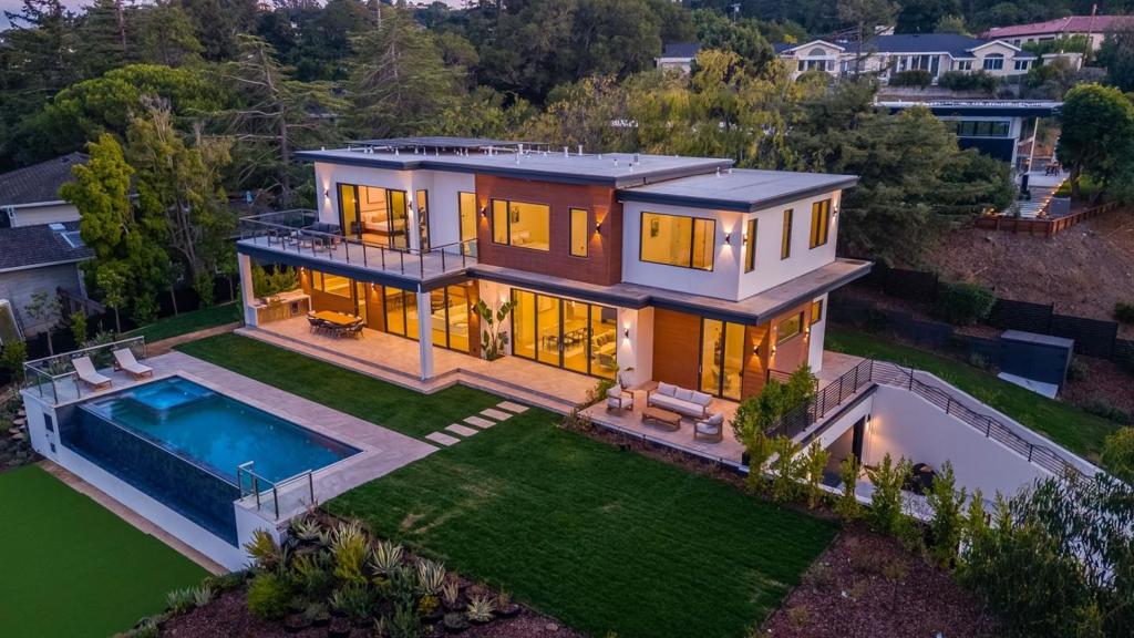 BRAND NEW ECO-FRIENDLY MODERN HOME WITH PANORAMIC BAY VIEWS. DESIGNED FOR ENTERTAINING, THIS 7160SF HOME FEATURES 8 BEDROOMS, 8 FULL AND 2 HALF BATHS, SEPARATE ADU WITH 2 BEDROOMS AND SEPARATE PARKING, OPEN CONCEPT DESIGN WITH NUMEROUS LUXURY FEATURES INCLUDING, 4K MOVIE THEATRE, GAME ROOM, SAUNA, GLASS ENCLOSED WINE CELLAR, AND LARGE INFINITY POOL AND SPA. THE CHEF'S KITCHEN SHOWCASES MIELE APPLIANCES, CLEAF WHITE OAK CABINETS, TAJ MAHAL HONED COUNTERTOPS, AND SEPARATE BUTLER'S PANTRY. THE EXPANSIVE PRIMARY SUITE HAS A COZY FIREPLACE, EXPANSIVE VIEWS, VIEWING PATIO, LARGE WALK-IN CLOSET AND HIS/HERS WATER CLOSETS. ENHANCED BUILT-IN TECHNOLOGY INCLUDES AN UBIQUITI WIFI SYSTEM, SECURITY CAMERAS, ELEVATOR, WHOLE HOUSE AIR AND MOISTURE FILTRATION SYSTEM, SOLAR PANELS AND LUTRON LIGHTING. DESIGNED BY SAFAEI DESIGN GROUP, THIS HILLSBOROUGH ESTATE IS DESIGNED FOR ENTERTAINMENT AND RELAXATION!