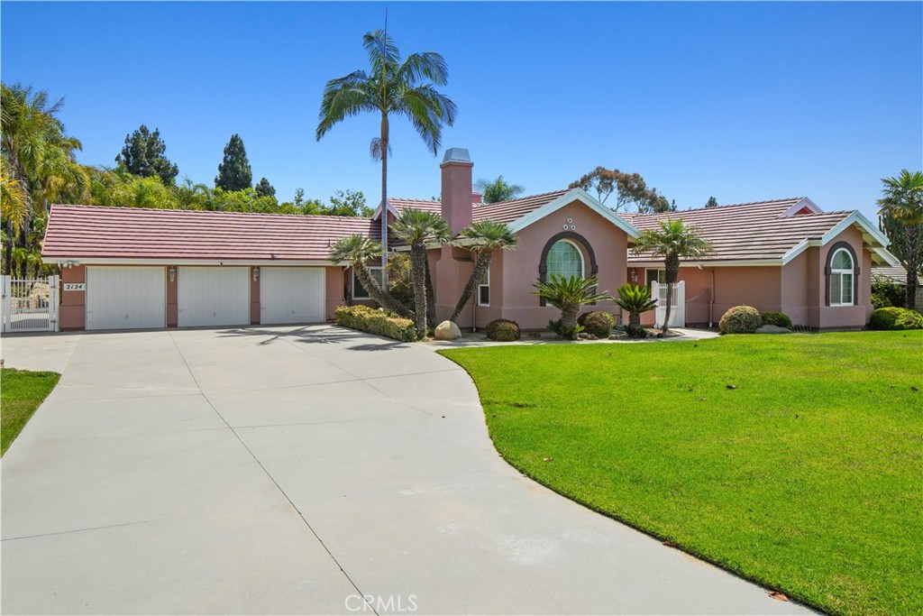 Located in the Regency subdivision, one of the most sought after neighborhoods in Camarillo, this well maintained single story home sits on an over half acre lot with lovely mountain views. Featuring 3 fountains and ponds, the front and rear yards invite you to enjoy extensive hardscaped paths, a large gazebo, and ample grass and patio for entertaining. A grand foyer entrance contains double french doors that open on to the informal great room with fireplace. In the left wing of the home a breakfast nook, formal dining area and powder room enhance your entertainment options. The property has a three car garage and separate laundry room both with pedestrian doors to the back yard. The right wing off the foyer contains 4 bedrooms. The largest opens onto back yard through double french doors and features a fireplace, walk in closet and ensuite bath with shower and tub accomodations. Two other bedrooms and a dressing room/fourth bedrooms complete the single story floor plan.
