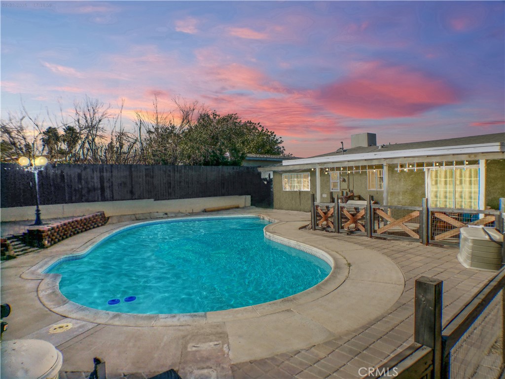 Desert Pool Home Priced to Sell!
Step inside and imagine coming home after a long day — pulling into your private driveway, walking through the door into a space that just feels right. The updated kitchen greets you with warm tones and modern appliances, ready for whatever the day brings — whether it’s a quiet dinner or weekend gathering. Slide open the back door and step onto a covered patio ready for your personal touch — whether you envision a BBQ paradise, an entertainer’s dream setup, or a peaceful private retreat. From there, view your own fenced-in pool — sparkling in the desert sun, offering a peaceful place to unwind or entertain. It’s easy to picture warm summer nights, cool dips, and laughter echoing through the air.
Inside, the layout is both functional and inviting. This 3-bedroom, 2-bathroom home includes a spacious primary suite with a walk-in closet and private bath, plus a second walk-in closet in one of the additional bedrooms — perfect for extra storage. The attached 2-car garage adds convenience, and the cozy feel throughout makes this home a place you’ll look forward to returning to.
Although tucked into an established neighborhood, this home is just half a mile from some of the area’s most popular dining and drive-thru spots — convenient enough to swing by on your daily route, yet far enough to keep the neighborhood undisturbed. With quick freeway access just minutes away, it’s an ideal location for commuters looking for both comfort and connectivity.
Come experience the charm, comfort, and lifestyle this High Desert home has to offer — it’s a space that truly brings it all together.