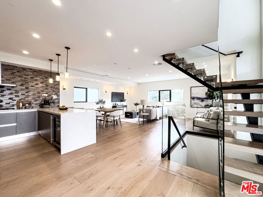 Welcome to a truly EXCEPTIONAL  living experience at 4801 Carpenter Ave in the heart of Valley Village! ""Colfax, BLUE RIBBON CHARTER Elementary School"".This magnificent 2018-built SINGLE FAMILY HOME offers a seamless blend of modern luxury and sophisticated design across three impressive floors.Step inside and be captivated by the spacious living area, adorned with elegant wood flooring throughout. This home boasts 4 generously sized bedrooms and 3.5 lavish bathrooms, providing ample space and comfort. Imagine entertaining guests in the bright South/East exposure and airy living room, preparing culinary delights in a kitchen , Tankless water heater, pre-wired. This property offers a private attached garage with direct entrance for ultimate convenience. Enjoy scenic views from various vantage points, adding a touch of charm to your daily life. With central air conditioning and heating, comfort is guaranteed year-round.Located in a vibrant neighborhood, you'll enjoy excellent walkability and biking scores, with Colfax Charter Elementary School, Walter Reed Middle School just a short distance away. Plus, you're minutes from Burbank Airport and enjoy easily accessible freeways to downtown Los Angeles or Santa Monica. This home is not just a residence; it's a lifestyle, offering unparalleled elegance and modern conveniences for the discerning homeowner.