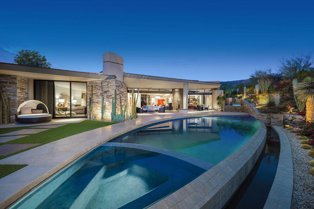 Spectacular valley views, gated entry. Four bedrooms plus office and theater. Custom infinity edge pool and outdoor living room with fireplace and flat screen TV. Additional prep kitchen. Three car plus two golf cart garage w/storage sink and expoxy flooring.