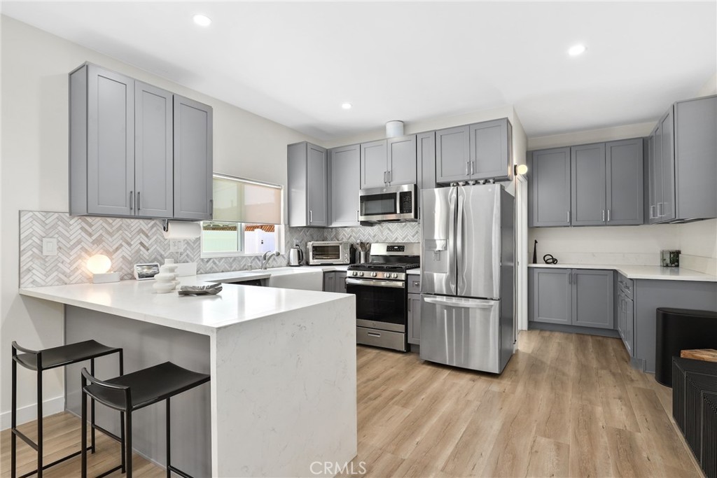 PRICE REDUCED TO SELL NOW! Welcome home to 2129 N Pepper Street. This stunning 3 UNIT PROPERTY sits on a generous 6,753 sqft lot and offers an exceptional opportunity for both investors and owner-occupants—a rare gem on a beautiful tree-lined street in the heart of Burbank. MAIN HOUSE, JADU & ADU ALL WITH SEPARATE ADDRESSES. Whether you’re looking to live in one unit and rent the others or expand your portfolio with a high-yield asset, this property delivers flexibility, income potential, and long-term value. The front unit is the original home: a 2-bedroom, 1-bath layout spanning 860 sqft, currently leased at market rent for $2,900/month, providing immediate income. It features a private fenced back patio, front yard, 1-car garage, and 2-car driveway. Attached is a brand-new, separately accessible JUNIOR ADU (JADU) 1-bedroom, 1-bath addition. This thoughtfully designed 440 sqft unit feels independent, with its own entrance, address, fenced private patio, in-unit laundry, and modern split A/C system. It’s vacant and ready to generate an estimated $1,900/month. Towards the rear, you’ll find a fully detached, newly constructed FULL Accessory Dwelling Unit (ADU), built in 2024. This spacious 997 sqft home includes 2 bedrooms, 2 baths, and contemporary finishes throughout. The ADU also offers a fenced private patio. Like the middle unit, it will be delivered vacant, with an estimated rental potential of $3,500/month. Together, these three units total 2,297 permitted sqft and offer a combined projected monthly income of up to $8,300. The property includes a paid-off 8-panel solar system supplying power to the rear unit, adding efficiency and reducing utility expenses. A new roof and copper plumbing throughout offer added value and peace of mind for the next owner. The location is unbeatable—minutes from Magnolia Park’s boutiques and cafés, Porto’s Bakery, Costco, and the Empire Center. It’s less than ten minutes to Warner Bros, Disney Studios, and vibrant Downtown Burbank, just north of Magnolia Boulevard and the Chandler Bike Path, within the sought-after Burbank Unified School District. Whether you’re looking to plant roots or collect steady rental income in one of LA’s most desirable neighborhoods, 2129 N Pepper Street is a rare, move-in-ready opportunity that checks every box.
