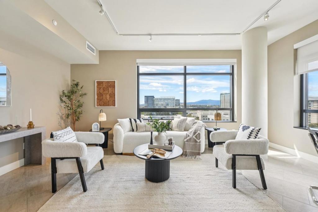 Luxury high-rise living in the heart of Downtown San Jose! This sought-after corner unit at The 88 offers sweeping views of the eastern and southern foothills through large picture windows in the living area and both spacious bedrooms. The open floor plan connects a chefs kitchen, featuring stainless steel appliances, granite slab counters, built-in cabinets, and a wine cooler to a bright and inviting living space. Additional highlights include indoor laundry, custom closet organizers, two well-appointed bathrooms, and instant hot water for enhanced comfort. Residents enjoy resort-style amenities: pool, hot tub, fitness center, clubhouse, BBQ area, pool table, and a sky deck with panoramic views. Plus, 24-hour concierge service provides added convenience and security. 2 side-by-side deeded parking spots. Amazon Locker on the first floor. Ideally located just steps from restaurants, shopping, entertainment, and public transit, this high-rise condo offers the perfect blend of lifestyle and location.
