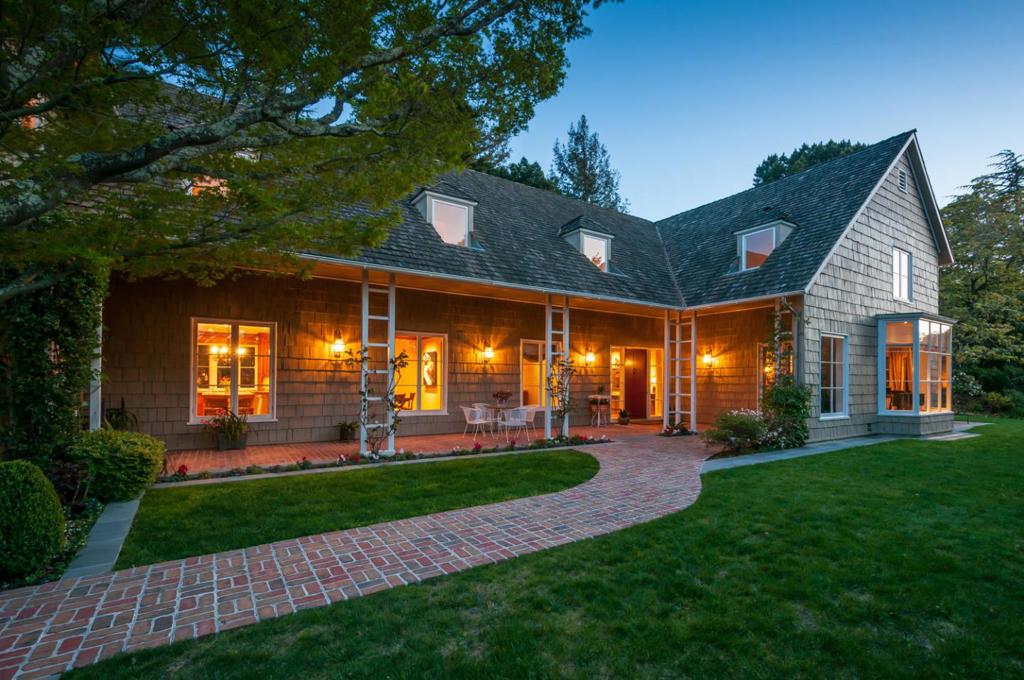 Elegance abounds in this original William Wurster design that was expanded and restored to perfection by renowned local architect Farro Essalat. Tucked away on approximately .73 acres of outstanding verdant grounds, 989 Hayne Road is a rare gem that is to be cherished for generations to come. Every feature of this five bedroom, five and one-half bath home offers the highest level of design, impeccable attention to detail, and masterful craftsmanship. The welcoming foyer with beautiful curved staircase is a fitting prelude to the grandly-proportioned interior spaces, which include a library, billiard room, huge family room and mud room. The delightful flow of this exceptional home extends to the incredibly-manicured grounds, offering beautiful planter beds, tranquil garden pathways, a rose garden, fire pit, superb outdoor kitchen, and spa with Bay views. This magnificent estate presents a unique opportunity for the discerning owner seeking that special, one-of-a-kind property.