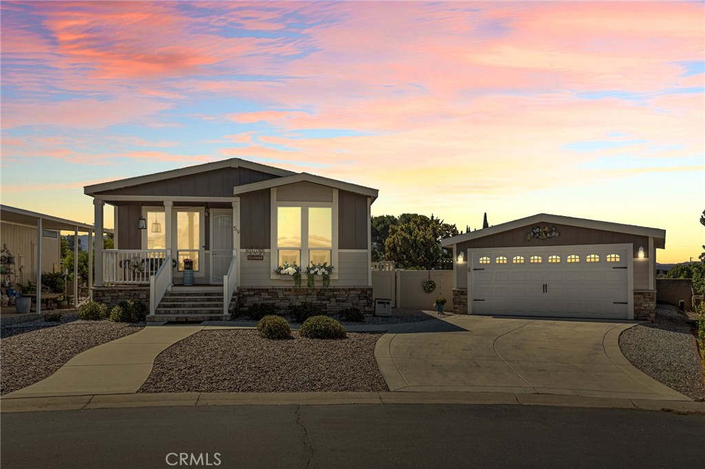 BETTER THAN NEW~ Rare Find in a 55+ Mobile Home Yucaipa Community! Built in 2020, this immaculate manufactured home is truly better than new and located in the highly desirable, rent-controlled Mission Valley Oaks. A cozy 55+ community in a prime Upper Yucaipa location. This move-in ready home offers an exceptional backyard oasis perfect for entertaining or enjoying peaceful mornings. The recently added back deck leads to beautifully designed outdoor living areas, including an entertainment space, outdoor dining area, and a lush artificial turf lawn. Well-planned walkways connect everything seamlessly, leading to the spacious 2-car detached garage. Enjoy true privacy in the fully fenced backyard with block walls and elegant vinyl fencing, all complemented by low-maintenance landscaping and a drip irrigation system. Inside, the home boasts 3 bedrooms (one currently used as a home office), each with updated flooring (installed within the past two years) and extra-tall windows that bathe the rooms in natural light. The main living area features 9-foot ceilings, tinted windows, and durable vinyl plank flooring throughout the open-concept layout. The kitchen showcases solid wood cabinetry, solid surface countertops, a central island with bar seating, a stylish range hood and abundant storage. The primary suite is generously sized to accommodate a California King and features a custom barn door, walk-in closet, double vanities, a floor-to-ceiling tiled walk-in shower, and a huge linen closet. This is a unique opportunity to own one of Yucaipa’s most unique Mobile Homes in a park, with a garage and yard, while being just minutes from shopping, dining, and popular community events.
DON'T MISS THIS GEM—it’s everything you’ve been looking for!