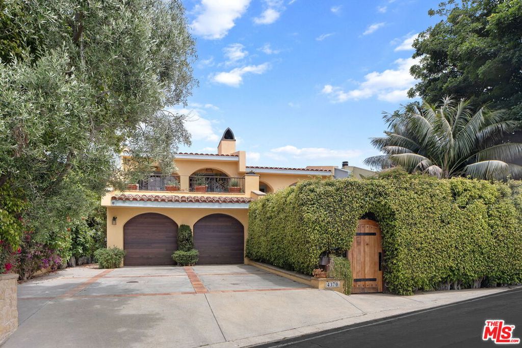Perched in Latigo Canyon with rare east- and west-facing ocean views, this Provenal-inspired retreat captures the full arc of the sun from peaceful morning light to dramatic Malibu sunsets. Every detail of this home reflects timeless craftsmanship and understated elegance, from reclaimed French fire brick and hand-carved Santa Barbara stone to wide-plank French oak floors throughout. Three bedrooms features their own en-suite baths, creating a private and luxurious experience for family and guests. A versatile bonus room offers the perfect space for a nursery, home office, or studio. At the heart of the home, a double-sided fireplace anchors an expansive den that flows seamlessly onto a west-facing ocean view terrace ideal for sunset entertaining or quiet evenings under the sky. The front courtyard invites long lunches and al fresco dinners, while the beautifully landscaped backyard with its custom spa, outdoor shower, stone fireplace, and terraced fruit trees faces east, bathed in golden morning light and framed by serene canyon and ocean views. Effortlessly blending the soul of the French countryside with the ease of coastal California living, this home is a rare Malibu offering authentic, intimate, and designed for a life well-lived.