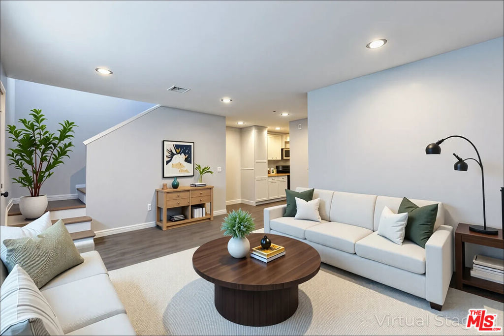 Experience elevated coastal living in this beautifully reimagined 4-bedroom, 2-bath end-unit residence, tucked away in a quiet, secluded corner of Long Beach's vibrant Westside. This rare two-level home spans 1,059 square feet of refined interiors, thoughtfully designed for comfort and style. Step inside to discover a main-level primary suite, recessed lighting throughout, and a modern kitchen finished with imported quartz countertops and sleek stainless steel appliances. Upstairs, three sunlit bedrooms and a contemporary full bath provide flexible space for family, guests, or a home office. Enjoy the ease of in-unit laundry, your own private one-car garage plus an additional parking space, and low-maintenance living with HOA-covered water and trash services. Perfectly positioned for commuters and explorers alike, you're just moments from the 710, 405, 110, and 91 freeways offering seamless access to Downtown LA, Orange County, and major business districts. Indulge in nearby shopping, dining, and entertainment at The Pike Outlets, Shoreline Village, and Long Beach Towne Center. Surrounded by rich cultural landmarks and natural beauty, this location puts you close to historic sites like the Los Cerritos Ranch House and Scottish Rite Cathedral, while also offering easy access to Bluff Park, the Long Beach Museum of Art, and scenic coastal trails. A rare opportunity to own a private, end-unit sanctuary in the heart of the city where modern design meets timeless Southern California charm.