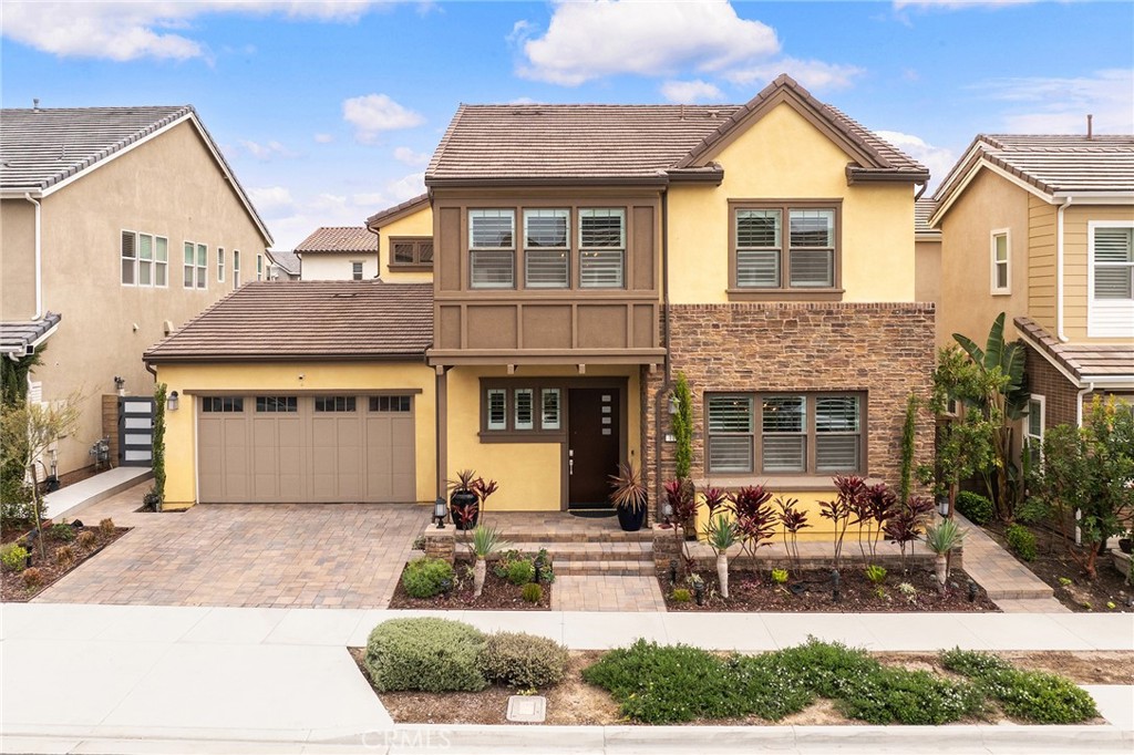 Welcome to luxury living in Great Park, Irvine. This spacious Lennar Capella Residence 1 at Cadence Park offers 3,754 sq. ft. with 4 bedrooms, 4.5 bathrooms, and sits on an ~6,000 sq. ft. lot. Featuring soaring ceilings, an open floor plan, and premium upgrades, this home blends indoor and outdoor living. The expansive great room flows seamlessly into the chef’s kitchen with oversized island and walk-in pantry. Sliding doors open to a California room with fireplace, dining space, and serene water feature. The luxurious primary suite features a spacious bedroom and spa-inspired bath, while a main-floor guest suite provides added convenience and each additional bedroom includes its own private en-suite. The backyard is a private oasis with a sparkling pool, built-in barbecue, lush landscaping with fruit trees and flowers, multiple seating areas, and walking paths. Located on a quiet cul-de-sac within walking distance of award-winning schools, parks, and resort-style amenities, this home combines elegance, comfort, and the ultimate Irvine lifestyle. Don’t miss the opportunity to make this prestigious residence your own.