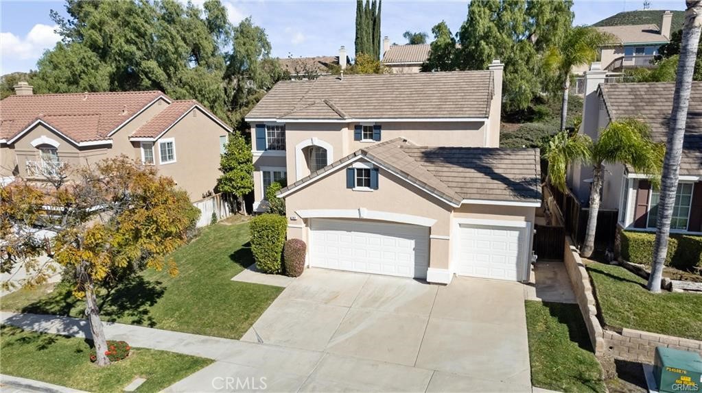 Welcome to this Beautiful two-story home located in Corona Hills! It features 4 bedrooms and 3 bathrooms plus a loft that could be a fifth bedroom, 3 car attached garage, title roof, two tone staircase, formal dining room, living room, cozy family room with fireplace that opens to kitchen area. The kitchen has white cabinets, Quartz counter tops and stainless-steel appliances. It also features a main floor bedroom and full bathroom, laundry room with washer/dryer included and loft on the second floor that could be used as an additional bedroom.