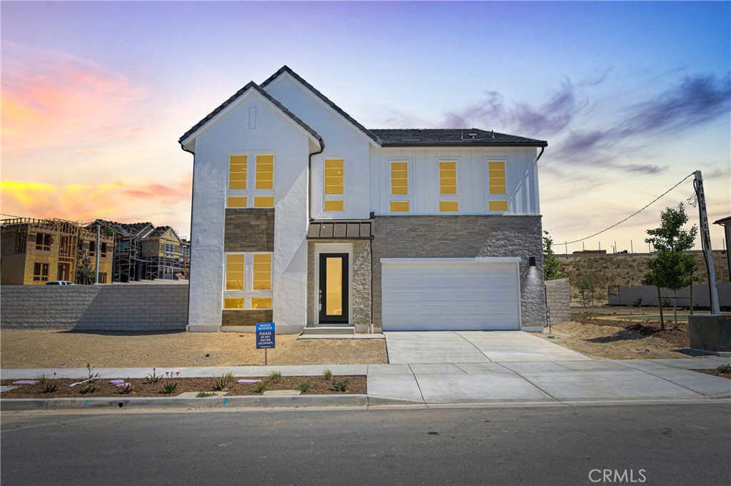 Modern luxury home located in the sought-after Five Points at Valencia! Complete with top-tier design features in a desirable location, this is the home you've always dreamt of.
Inviting 2-story foyer flows past the formal dining room, revealing the soaring two-story great room. For your guests, this home includes a bedroom and private bath downstairs. The expansive open kitchen is a chef's dream, boasting Wolf and Sub-Zero appliances, add to the luxury of this beautiful new home. Enjoy a 48" fireplace in your cozy great room. Upstairs, the generous loft offers versatilely for entertaining. This home offers an expansive Primary Bedroom Retreat and three more secondary bedrooms upstairs, highlighted by each gorgeous ensuite bathroom.
This home is not only beautiful but also energy efficient, boasting a tankless hot water heater, programmable smart thermostats, and solar panels. The great community offers so much! Pools, spa, club house, multimodal paths, gardens and a playground. Located minutes from I-5, Six Flags Magic Mountain and Valencia Westfield Mall. Easy access to shopping, dining, entertainment and highly-rated schools.
Experience luxury living in this incredibly rare dream home and schedule your private tour today!