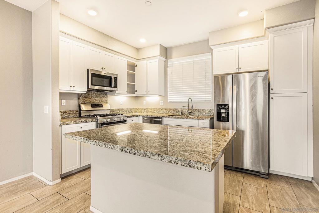 Welcome to 840 Athens Rd Unit 10 — a beautifully upgraded townhome tucked in the heart of Chula Vista’s highly desirable Eastlake neighborhood. This move-in ready home perfectly blends style, function, and location. Step inside to discover an inviting open-concept layout filled with natural light, featuring luxury vinyl plank flooring, recessed lighting, and fresh, neutral tones that make every space feel warm and modern.  The chef’s kitchen is designed to impress with stainless steel appliances, sleek granite countertops, and a generous island — ideal for casual dining or entertaining guests. Upstairs, you’ll find spacious bedrooms with ample closet space, a serene primary suite with dual sinks and a walk-in closet, and an upstairs laundry for added convenience.  Enjoy your morning coffee on the private patio or relax in the community’s sparkling pool and spa. This gated complex also features lush greenbelts, playgrounds, and walking trails that connect to nearby parks, schools, and shopping.  Located minutes from Otay Ranch Town Center, top-rated schools, dining, and major freeways — everything you need is right at your doorstep. Whether you’re a first-time buyer, growing family, or looking to downsize, this home offers the perfect blend of comfort and community.  Come experience the lifestyle Eastlake is known for — modern living, beautiful amenities, and a true sense of home!