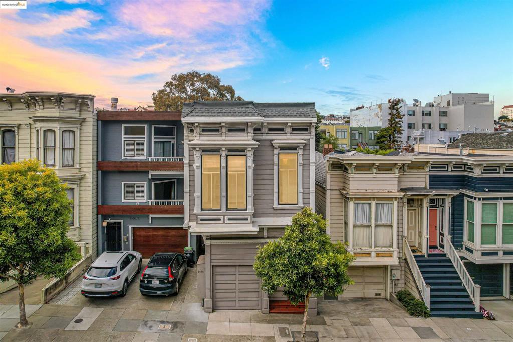 Experience timeless San Francisco living in this exceptional 2,502 sq ft Victorian duplex, ideally located in Lower Pacific Heights. Blending historic elegance with modern comfort, this treasure offers flexibility, income potential, and classic charm. The upper 3-bed, 2-bath unit is fully remodeled and vacant, featuring a light-filled kitchen that flows into a vaulted-ceiling living room anchored by a vintage marble fireplace. A solarium-style glass enclosure opens to views of the lush backyard—perfect for enjoying natural light year-round. The 2-bed, 1-bath lower unit, currently owner-occupied and available to be delivered vacant, includes a cozy living room and a cheerful kitchen with a breakfast nook, offering comfort and functionality. Outdoors, the shared backyard is a serene urban retreat with shade trees and bamboo. The attached garage adds everyday convenience. All just minutes from Fillmore Street, Alta Plaza Park, The Presidio, and the shops and cafés of Laurel Village and Sacramento Street. Whether you're looking to live, rent, or invest, this sophisticated duplex delivers location, lifestyle, and lasting value in one of San Francisco’s most desirable neighborhoods.