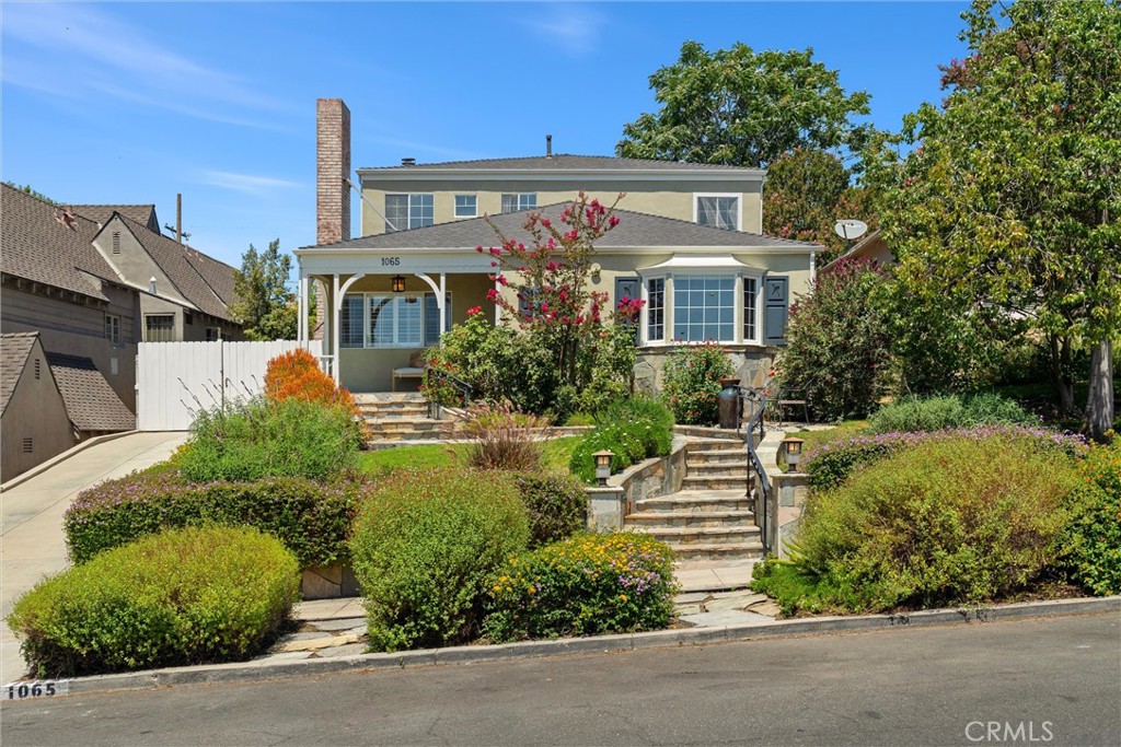 Positioned in Burbank’s coveted Hillside District, 1065 E. Harvard Rd is a thoughtfully updated traditional that offers space, flexibility, and timeless appeal.
With 4 bedrooms, 5 bathrooms, and 2,786 sq ft, this home is designed for comfort and everyday function. The formal living room features original hardwood floors and a character-rich fireplace. The kitchen connects to a dedicated dining area and a relaxed family room, creating an easy flow for gatherings.
Two bedrooms are located on the main level, one of which features an ensuite bath for added flexibility. Upstairs are two more bedrooms, including the expansive primary suite with a walk-in closet, a beautifully remodeled bathroom with dual vanities, a soaking tub, and a separate shower, plus a balcony off the bedroom overlooking the backyard. Another ensuite bedroom sits down the hall, and a bonus room just across from the primary offers the perfect space for a nursery, office, or private retreat.
In the backyard, a tranquil koi pond with a waterfall anchors the lush landscaping. Generous patio space invites outdoor dining and entertaining. A finished detached bonus studio offers flexibility for a home office, gym, creative space, or possible ADU.
Additional highlights include dual-zone HVAC and a detached 2-car garage with attic storage and convenient alley access. Conveniently located near top-rated Burbank schools, hiking trails, and local parks. Just minutes from the Starlight Bowl, DeBell Golf Course, Disney and Warner Bros Studios, Castaway Restaurant, Kenneth Village, and vibrant Downtown Burbank.
1065 E. Harvard Rd offers the space you need, the location you want, and the charm you didn’t think you’d find.