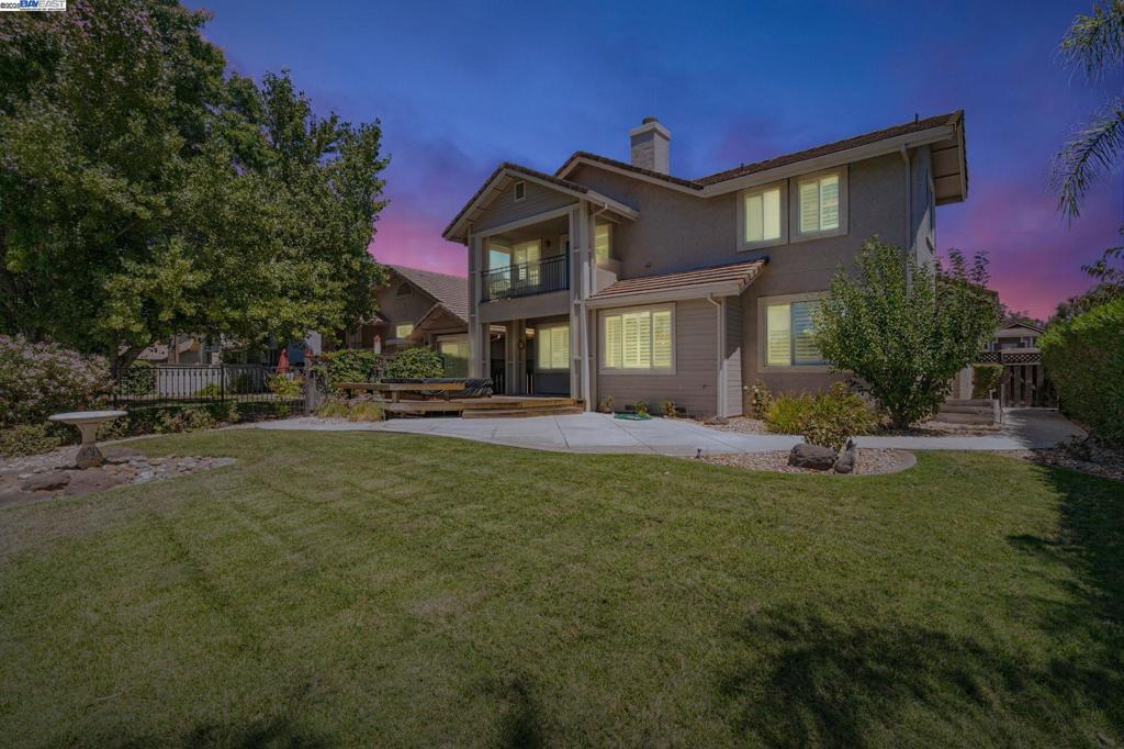 Prepare to embrace the ultimate resort lifestyle in this prestigious, gorgeous gated community. This isn't just a home within walking distance of the beautiful Discovery Bay Golf Course – it's ON THE GOLF COURSE! Your beautifully landscaped backyard literally backs up to the greens, offering unparalleled access and views. As you step into this expansive home, you'll be immediately welcomed by a large and inviting living room and dining area, setting the stage for elegant entertaining. Continue your tour of the first floor to discover a comfortable family room with a cozy fireplace, perfect for relaxation, as well as a convenient guest suite complete with a full bathroom. Ascend the grand staircase to find two generously sized bedrooms sharing a functional "jack and jill" bathroom. The true highlight awaits in the captivating owner's suite, featuring a magnificent balcony that provides breathtaking, sweeping views of the golf course. This house is ready to become YOUR home. Stop compromising on someone else's vision; this property eagerly awaits your unique personal touches to truly make it your own!