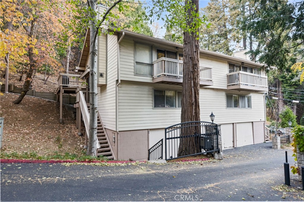 Escape to the mountains with this beautifully renovated townhouse in Lake Arrowhead, where modern convenience meets mountain charm. This 4-bedroom, 2-bathroom retreat is perfect for year-round living or a weekend getaway. Conveniently located near the main road, which is plowed for easy access in any season, this home ensures hassle-free travel. The open floor plan creates a seamless flow between the deck, dining area, and living space, offering a warm and inviting atmosphere for relaxation or entertaining. Step outside to your private decks, the perfect spots to unwind or host friends while enjoying the serene surroundings.
This townhouse is just a short distance from the community pool, offering a refreshing escape during warmer months. A private 2-car garage provides ample storage for your mountain gear, making it easy to enjoy the outdoor lifestyle. The HOA takes care of exterior maintenance, trash, and water, ensuring a low-maintenance lifestyle. Additionally, you’ll enjoy day-use access to the community docks and clubhouse, ideal for boating, fishing, or social gatherings. With its exceptional location, modern upgrades, and array of amenities, this townhouse invites you to relax and enjoy everything Lake Arrowhead has to offer. Don’t miss this incredible opportunity to own a one-of-a-kind mountain retreat!
