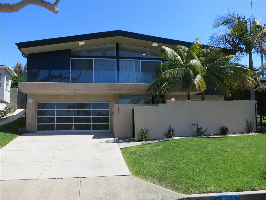 Spacious sunny contemporary pool home in Lower Hollywood Riviera. Fresh paint, new carpet, and updated just a few years ago. 5 bedrooms and 3 full bathrooms with one primary suite downstairs (would also make a great family room or WFH office space). A second primary suite upstairs off living room, and 3 more bedrooms and 1 bathroom in the rear bedroom wing. Kitchen with breakfast bar opens to family area with fireplace, and looks out on to the backyard area with pool and multi-level decks for entertaining. Central A/C. Across the street and easy access to El Retiro Park, a five acre city park with childrens playground, tennis and basket ball courts, picnic area, satellite library, and huge grassy tree-lined fields to relax and enjoy. Easily walkable to Riviera Village, the Esplanade and the beach and beach bike path. Close to 3 markets plus Trader Joes and many great restaurants. Torrance school district, South High, Richardson Middle School, and Riviera Elementary - rated 9, 8, and 8 respectively by GreatSchoolsDotCom.