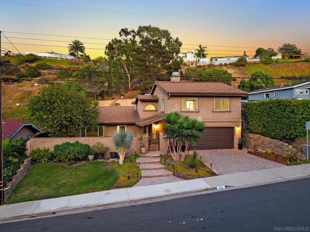 Welcome to 2261 Garfield Rd, a private retreat tucked away in the quiet hills of Bay Park. With over 2,500 sq. ft. of living space, this home blends thoughtful design with owner-quality finishes, creating a residence that feels both refined and inviting. Inside, you’ll find two spacious primary suites, each offering comfort and privacy. The upstairs suite is a true sanctuary, featuring hillside and park views along with a fully remodeled spa-inspired wet room, complete with a rainfall shower and soaking tub. The flexible floorplan showcases oversized bedrooms, an office/living space perfect for working from home, and even a charming playhouse. Set on a quarter-acre+ lot, the property is wrapped in lush landscaping that provides serenity, security, and a sense of retreat. Just steps from Western Hills Park with views of Mt Soledad, the location combines rare privacy with close proximity to green space, making it ideal for those who value peace and connection to the outdoors. Whether you’re entertaining, working, or simply enjoying the calm, this home offers a lifestyle defined by quality, comfort, and timeless design.