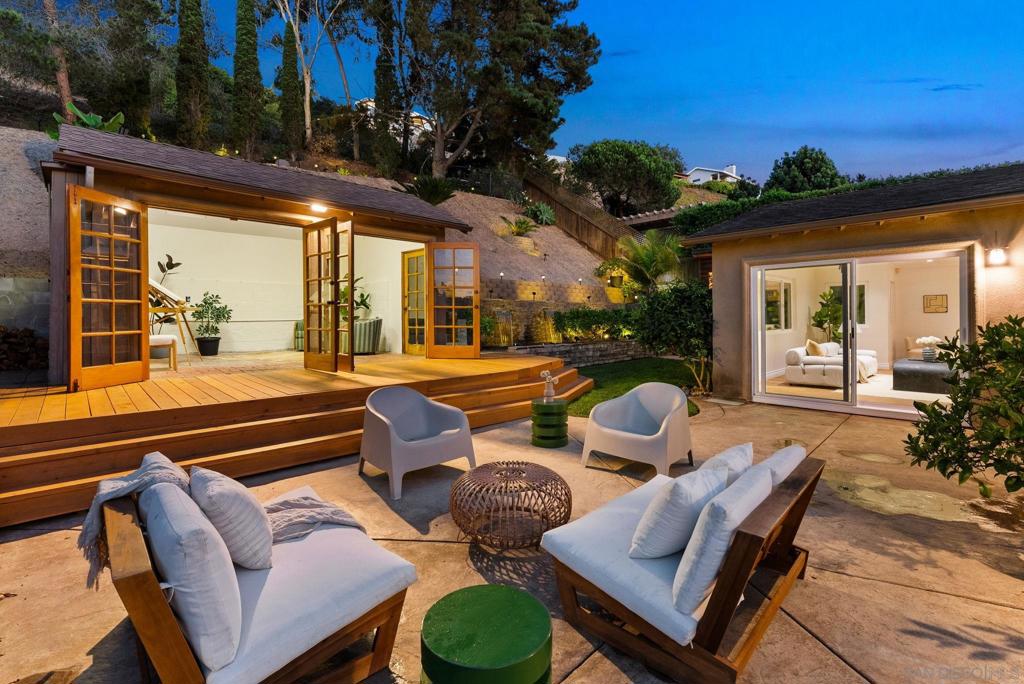 Welcome to 2261 Garfield Rd, a private retreat tucked away in the quiet hills of Bay Park. With over 2,500 sq. ft. of living space, this home blends thoughtful design with owner-quality finishes, creating a residence that feels both refined and inviting. Inside, you’ll find two spacious primary suites, each offering comfort and privacy. The upstairs suite is a true sanctuary, featuring hillside and park views along with a fully remodeled spa-inspired wet room, complete with a rainfall shower and soaking tub. The flexible floorplan showcases oversized bedrooms, an office/living space perfect for working from home, and even a charming playhouse. Set on a quarter-acre+ lot, the property is wrapped in lush landscaping that provides serenity, security, and a sense of retreat. Just steps from Western Hills Park with views of Mt Soledad, the location combines rare privacy with close proximity to green space, making it ideal for those who value peace and connection to the outdoors. Whether you’re entertaining, working, or simply enjoying the calm, this home offers a lifestyle defined by quality, comfort, and timeless design.