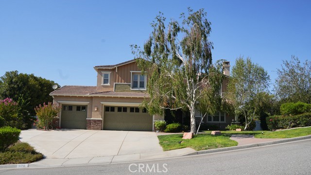 Opportunity is knocking for the discerning buyer on this Mockingbird Canyon Alicante Estates Home with gorgeous views! Solar, PAID in full. This home offers entry foyer, formal living and dining rooms. The Great Room offers kitchen with coffee bar, wine cooler in island, a walk in pantry, microwave, cooktop and double oven, informal dining and computer desk, a family room with stone fireplace, built in speaker system and a view you do not want to miss! Main level offers a bedroom with full ensuite bath, a laundry room, with folding counters and a soaking sink, a powder room, and access to the 3 car garage. Upstairs, there 4 bedrooms, one has an ensuite bath, 2 bedrooms have a jack-n-jill bath and the Primary Suite. Primary Suite offers a balcony with gorgeous views! there are his and her closets, and an extra large bathroom with two sinks, a makeup counter, jacuzzi tub and separate shower. There are linen cabinets and a bonus room with a balcony. The yard area is landscaped with plants, trees and flowers and a play area. The three car garage has one stall with a pull thru and a dog run set up.