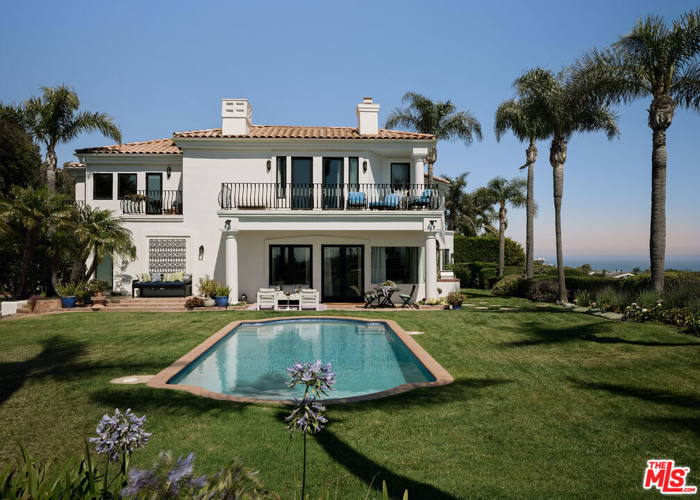 Tucked behind gates at the end of a long, privacy hedge-lined driveway, 6045 Galahad sits on over half an acre of mostly level grounds with a prime vantage above Malibu's iconic Point Dume. Nearly 200 degrees of Pacific ocean views take in the coves of Point Dume and the secluded sands of Little Dumeknown for their clear waters, rugged cliffs, and memorable surf. A quick golf cart ride to the beach, this modern Mediterranean property features a large flat pad with a pool framed by panoramic ocean vistas, a motor court for up to eight cars, and a three-car garage. Inside, 5 ensuite bedrooms (4 up/1 down) a dedicated large office, a dedicated theater room, with light-filled, voluminous social zones opening to terraces, a lighted pickleball court, and manicured lawns around a large pool perfectly designed for the idyllic California coastal lifestyle.