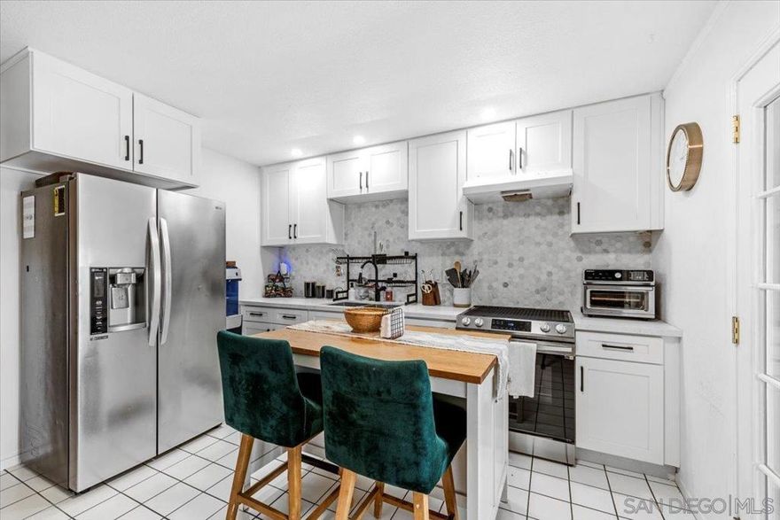 Welcome Home! Recently updated 2-story townhome features a sleek & modern kitchen. Bright natural light flood through the windows, making the wood stairway accent wall look great! Newer appliances include refrigerator, washer, and dryer— This property is ideal for a first-time buyer or investors. Enjoy close proximity to the pool and clubhouse. Patio includes sheds for added outdoor storage, laundry room & parking right outside gate. A charming, move-in-ready home in a desirable community—don’t miss out!  Buyers & buyers agent to verify all herein prior to submitting an offer!