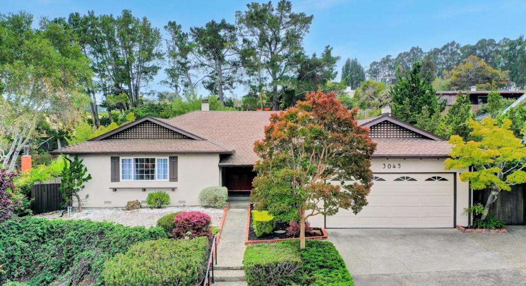Welcome to your tranquil retreat in the heart of Burlingame! First time on market, this 4-bedroom, 2-bathroom single-level ranch home sits on a serene 12,305 sq. ft. lot with nicely landscaped grounds, a patio, gazebo, mature trees, and garden area, perfect for outdoor living. With over 2,100 sq. ft. of living space, the home offers a light-filled, desirable floor plan. Step into the sunlit living room with fireplace and formal dining area, where you will find fresh interior paint, refinished hardwood floors & double-pane windows. The updated kitchen features new stainless steel appliances, freshly painted cabinets, ample counter space & cozy breakfast nook that flows into the family room with fireplace and sliding doors to the backyard. All four bedrooms are generously sized, including a spacious primary suite with en suite bath & freshly glazed stall shower. The hall bath offers dual sinks and shower over tub. Additional features include laundry area in the attached 2-car garage with storage. Outside, enjoy an expansive private yard with mature landscaping, perfect for relaxing or entertaining. Conveniently located just minutes from Burlingame Ave. Broadway shops & restaurants, Hwy 280, top-rated schools, SFO, BART, trails, and parks. Dont miss this Burlingame gem!