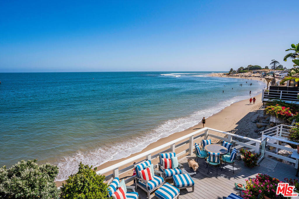 Rarely does a piece of history come on the market. This vintage Malibu cottage is one of only six homes on iconic Surfrider Beach, popularized in the "Gidget" and surf movies of the 1950's and 60's. Extra large wrap-around deck with gorgeous spaces for entertaining and checking out all three famous surf breaks. Grab your surfboard from the custom built holder and stroll to First, Second, and Third Points. The two ocean-front upstairs bedrooms, both with walk-in closets and private balconies, can also serve as two masters. Warm, inviting living room with high beamed ceilings, cozy fireplace, and large viewing windows to the blue ocean. Beautiful teak wood floors, 2 fireplaces, 3-zone air conditioning, and an oversized 3 car garage with extra storage space. This home is meticulously and lovingly maintained. Nestled next to the historic Malibu Pier and a short walk to Nobu, Soho House, and all the great shops & restaurants of Crosscreek. Move in today & enjoy this postcard beach tomorrow!