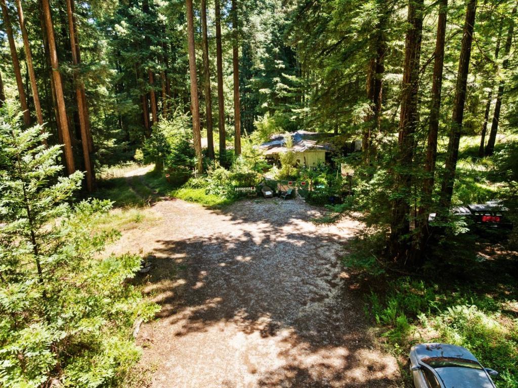 Tucked away on just over half an acre of mostly flat usable land in South Felton, this property offers the perfect canvas to bring your dream retreat to life. 1701 Felton Quarry features two separate sunny build sites, with parking for 20+ vehicles. Surrounded by over 50 acres of undeveloped forest land, the complete privacy is unmatched. With serene creek frontage to cool off on warm summer days, a strong-producing well, full septic system, and off-grid potential, you can create your own private oasis while enjoying self-sufficiency and natural beauty. Whether you envision a peaceful getaway or an inspired homestead, this is your opportunity to make it a reality.