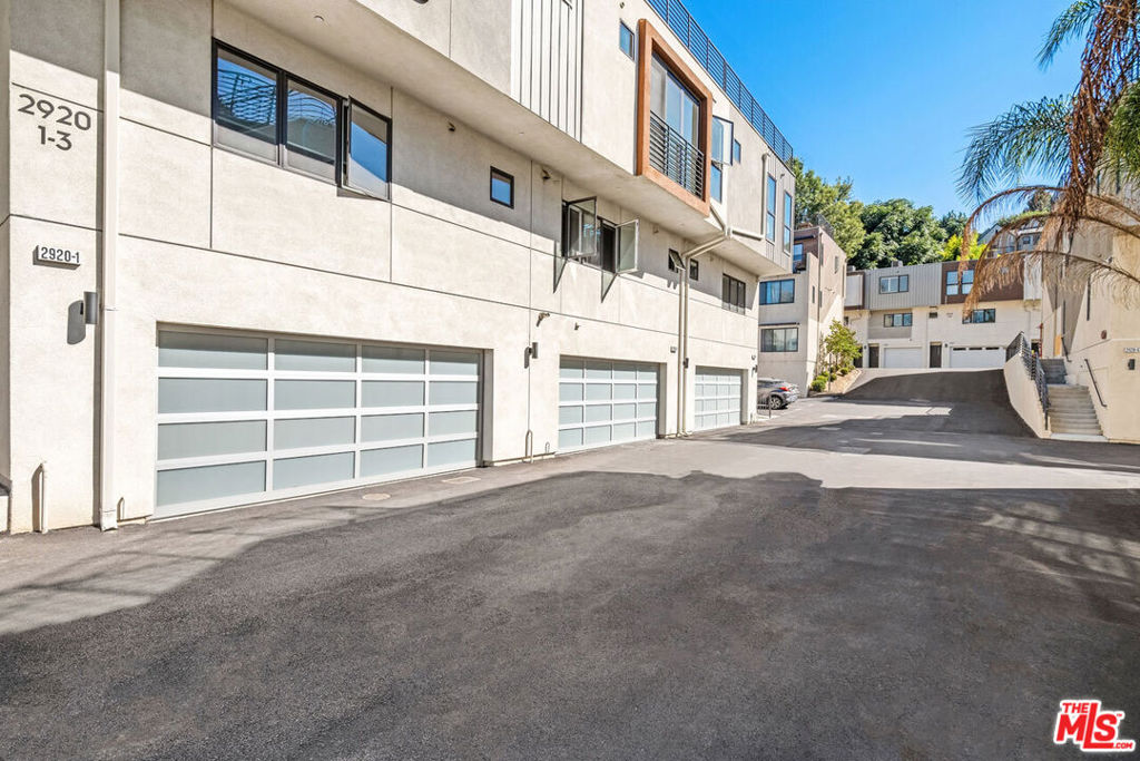 Set yourself up in Silver Lake with this great lease opportunity, a spacious modern townhome inside the Ivanhoe Elementary school boundary. Built in 2016 the unit has everything you need including a private two-car garage and ground-level bedroom suite that's perfect for your overnight guests, office or home gym. Living and dining flow to the open kitchen equipped with a center prep + dining island, quartz countertops and a full suite of stainless appliances. All three bedrooms have attached baths plus there's a powder room for guests; closets are equipped with Elfa storage systems. The private rooftop deck is a wonderful spot to relax with a book and host twilight dinner parties surrounded by gorgeous views of city lights and hillsides. Enjoy in-unit laundry, central heat + air and a prime location near Trader Joe's, Whole Foods, and dining and nightlife options including Forage, Blair's, Edendale, Zebulon and more. Griffith Park and the LA River Bike Path are within easy reach.