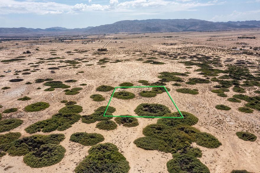 The parcel offers approximately 2.5 acres of vacant land. Located off Adobe Rd which is the main road leading the the 29 Palms Marine Base. The address is not official; it is only given for location.  Coordinates are 34.205014N,115.064331W.