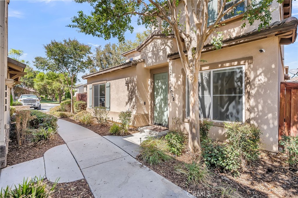 RIVERSIDE NORTHSIDE- just outside the bustle of the Downtown district and adjacent to the Santa Ana River preserve is this appealing gated community of GLENWOOD VILLAGE featuring a limited collection of single family homes centered around a private community park with amenities such as a pool and spa, playground and meandering walking trails. This exquisitely upgraded corner unit boasts a newly remodeled kitchen with high end finishes and appliances; Hardwood floors throughout; decorator selected colors and window treatments; Large Living area with loads of windows flooding the interior with natural light. Spacious dining area of the island kitchen. One ground floor bedroom and bath; Upstairs are 3 additional family bedrooms and 2 bathrooms including the luxurious primary suite. Indoor laundry, attached 2-car garage and a spacious yard and patio afforded by the rare corner location. Convenient guest parking nearby and a short walk to the pool/spa and park. Turnkey and ready for proud new owners! Nearby newly built Patricia Beatty Elementary School and minutes to all of the conveniences of Downtown including the Mission Inn, Fox Theater and the Main Street enternainment and dining district