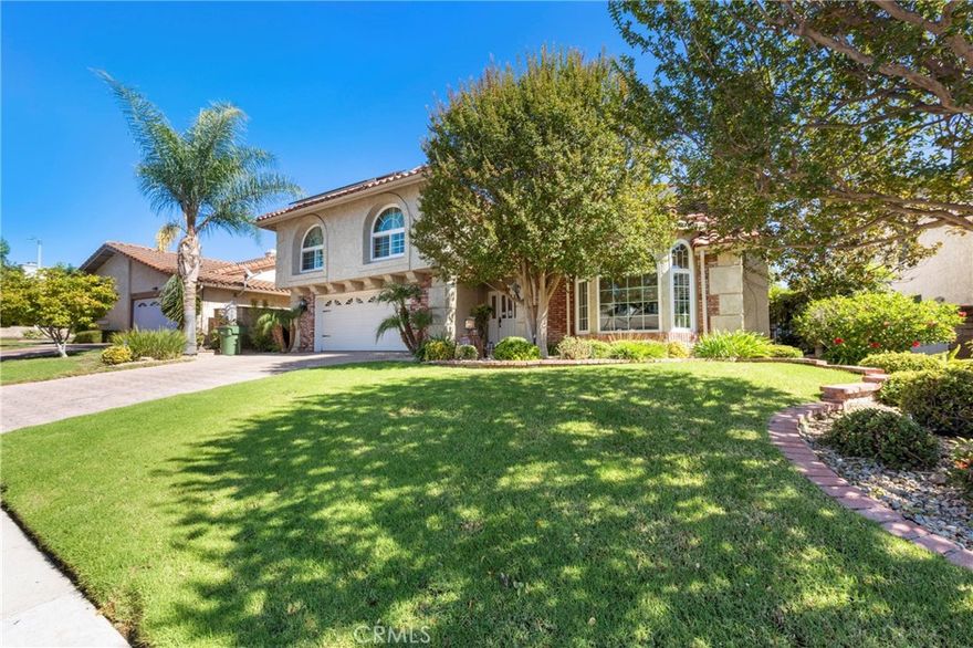 Welcome to the exquisite Morrison Ranch Estates, where this stunning luxury home is nestled in a serene cul-de-sac. As you step inside, a grand and sophisticated entryway awaits, featuring dramatic high ceilings that evoke a sense of elegance. This remarkable residence offers 5 bedrooms and 4 baths, catering to your family's desires and needs. The spacious formal living room is complemented by a cozy fireplace and seamlessly flows into the adjacent formal dining area, setting the stage for memorable gatherings. A gourmet kitchen awaits the culinary enthusiast, adorned with stunning granite countertops, a breakfast bar, and top-of-the-line appliances. Among these are a double Viking Oven with a professional-grade hood, a gas stove with a griddle, and a double refrigerator and freezer. An inviting dining area and a generous family room with a fireplace create an idyllic space for entertainment, all while overlooking the captivating pool and breathtaking outdoor setting. Upstairs, discover a collection of five meticulously appointed bedrooms. The expansive master suite is a haven of luxury, showcasing a delightful sitting room with a fireplace and a spacious walk-in closet. The primary bathroom is an oasis of relaxation, featuring tumbled marble, granite counters, an exquisite steam shower, and a separate jacuzzi soaking tub. Additional amenities elevate this residence to new heights of comfort and convenience including a new roof, Sun Run Solar system, skylights, newer windows, and elegant wood-like floors adorning the main level. Experience the ease of a smart house, with most functions accessible through a user-friendly app controlling the alarm system, pool, lights, heating, and AC. Immerse yourself in the allure of privacy and tranquility, enhanced by an exceptional resort-style lot boasting a pebble tech saltwater pool and spa. Indulge in outdoor recreation with a 1/2 sport court, an in-ground trampoline, and a new natural gas grill, complete with a sink and refrigerator. New pool equipment including a heater and filter, a new air conditioner, a modern water tank, and even a Tesla charging station complete the array of modern features. The location of this residence is unparalleled, boasting proximity to exceptional shopping, dining, and entertainment options. Moreover, it falls within the esteemed Las Virgenes School District. Embrace the splendor of this remarkable South Meadows location and seize the opportunity to call it your own.