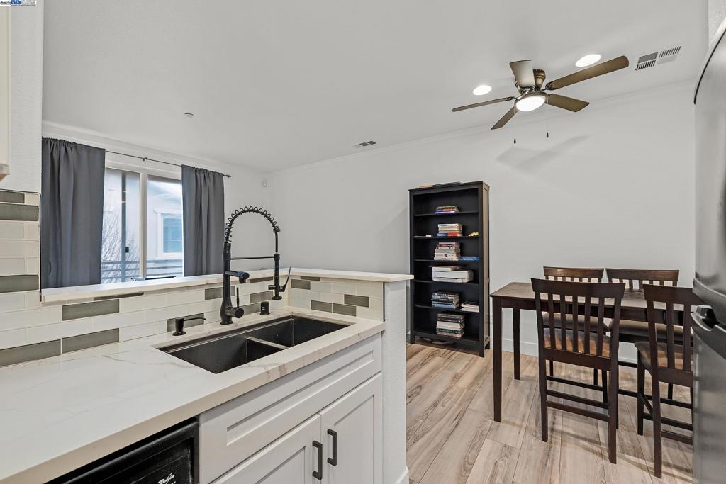 Bright & Modern Move-In Ready Condo in a Prime Location! Welcome to 1594 Tucker Street, a beautifully updated 2-bedroom, 2-bathroom condominium that blends modern comfort with a bright and inviting atmosphere. This charming home exudes warmth, featuring large sliding doors that flood the living room with natural light, creating an airy and welcoming space. Conveniently located just minutes from Highways 580 & 880 and a short 15-minute walk to BART, this home is perfect for commuters and city explorers alike. Built in 2002, this contemporary condo boasts remodeled bathrooms and an updated kitchen, complete with ceramic and tile countertops, sleek cabinetry, and modern finishes. The open floor plan is enhanced by elegant laminate flooring throughout—no carpet! Step outside onto the spacious attached deck, ideal for relaxing, entertaining, or enjoying your morning coffee. This move-in ready home also includes a one-car garage with ample visitor parking for added convenience. Located in a well-maintained community with a low HOA fee, you'll enjoy easy access to shopping, dining, and entertainment, making this home the perfect blend of style and convenience. Don’t miss this incredible opportunity—schedule your tour today!