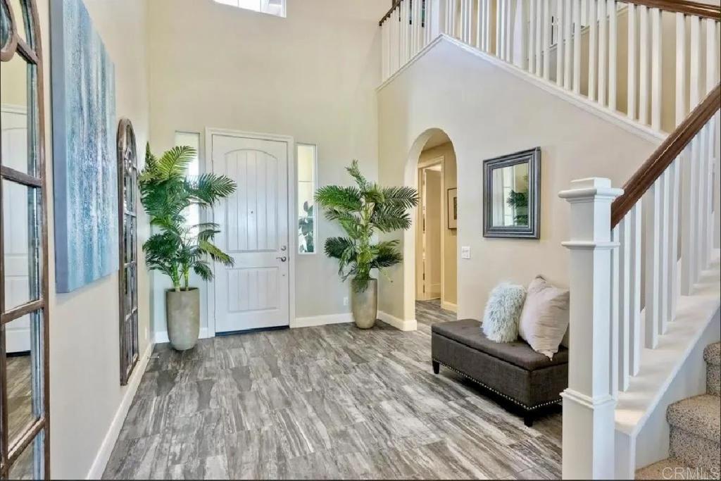 The Coastal lifestyle you've been dreaming of is here! Tucked away on a quite cul-de-sac just minutes from Oceanside Pier, this stunning 4-bedroom home with an upstairs loft offers over 3,300 sq ft. of living space. Designed for both comfort and efficiency, the home is equipped with solar panels that help keep the utility cost significantly lower. Step inside and you'll notice the abundance of natural light, open floor plan, and inviting living spaces. The oversized kitchen is a dream, with an island big enough to gather around, plenty of cabinet space, and a walk-in pantry. The living room features a cozy fireplace, and just off the main level you'll find a junior suite for added convenience. Upstairs, the open loft makes a great playroom, office, or media area. The primary suite is a true retreat with sweeping 275 city and ocean views from its private balcony. The ensuite bathroom includes a soaking tub with a view, dual sinks, and a separate shower, along with a generous walk-in closet. Two additional bedrooms share a Jack-and-Jill bath, making this layout ideal for families. The backyard faces west, so you'll enjoy stunning sunsets and panoramic valley and ocean views. It's an entertainer's paradise with a built-in BBQ, sitting area, and outdoor fireplace. Located within walking distance to Buddy Todd Park and just minutes to the beach, downtown Oceanside, and the 5 freeway, this home truly has it all. 4 Bedrooms + Loft | 3.5 Baths | Private Balcony | Ocean Views $6,500month | Available Now Pets OK with owner's approval