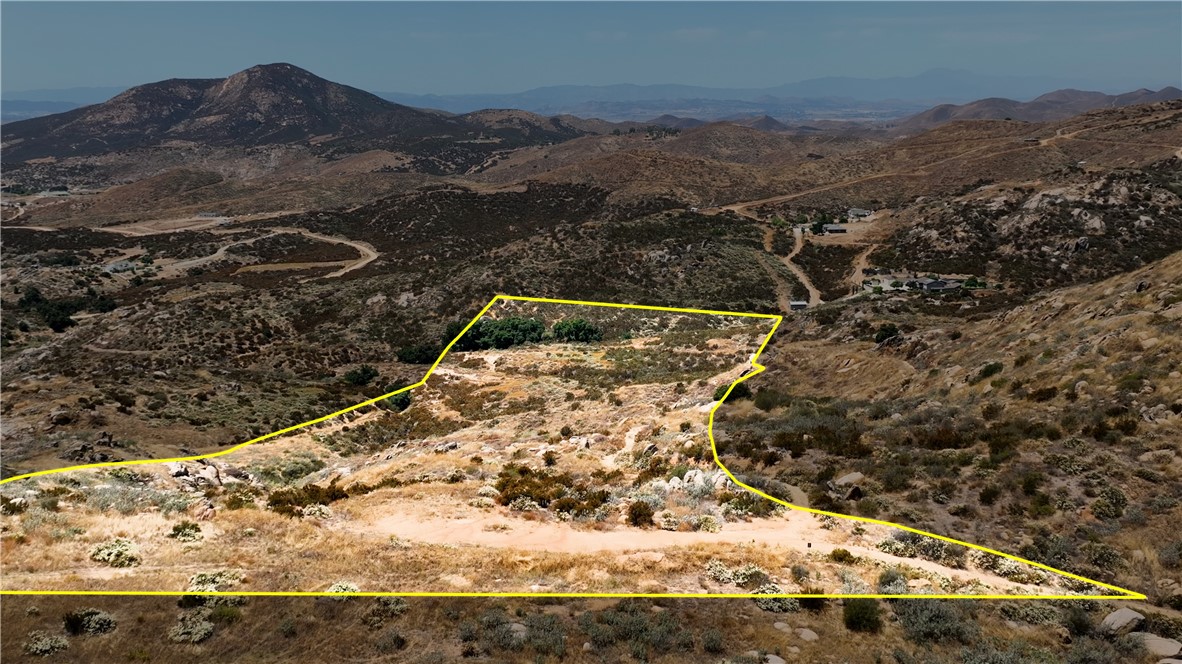 Large parcel Situated between the renowned Temecula Wine Country and Sycamore Springs. This +/-20 ACRE lot serves as a blank canvas for your dreams and vision. The lot features a flat summit that grants clear, panoramic views. From this vantage point, you can look out over Big Bear Mountain, the sparkling city lights of Temecula and Hemet, and a part of the scenic Diamond Valley Lake. Moreover, the property boasts ample usable space ready to be adapted to your preferences. Located a mere 15-20 minute drive from freeway. Leisure activities are plentiful, with Old Town Temecula, the Pechanga Casino, premium golf courses, and Wine Country within easy reach. This property truly gives you the best of both worlds – the tranquility and charm of the countryside, coupled with the amenities of modern living. Its unique boulders and rocks add an extra touch of character to this already fascinating land lot. Make this your perfect investment and bring your dreams to life.