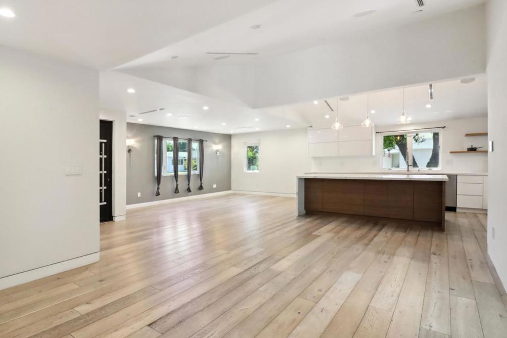 Situated in the prestigious enclave of Tarzana, this exceptional rental property redefines luxury living. The estate offers two distinct yet equally refined living spaces: a grand main home and an attached guest house.  The main home, comprising three bedrooms and two and a half baths, captivates with its open floor plan. The formal living room and dining area set an inviting tone, while the remodeled kitchen, a culinary masterpiece, features a substantial island with a waterfall quartz countertop, floating shelves, and top-of-the-line Miele stainless-steel appliances. The living room, enhanced with recessed lighting, a skylight, and a powder room, opens to the backyard through sliding doors. With two bedrooms, one bath, and a private entrance, the newly constructed guest house ensures utmost privacy. Both dwellings are integrated with the advanced Control4 security system, featuring comprehensive camera surveillance, a surround sound system, and sophisticated lighting controls. The expansive backyard is boasting a large fenced pool with a jacuzzi.  Located moments from the culinary delights of Ventura Boulevard, the scenic bike path to Topanga Mall, and a variety of religious centers, this property is tailored for discerning families seeking an unparalleled lifestyle in Tarzana.