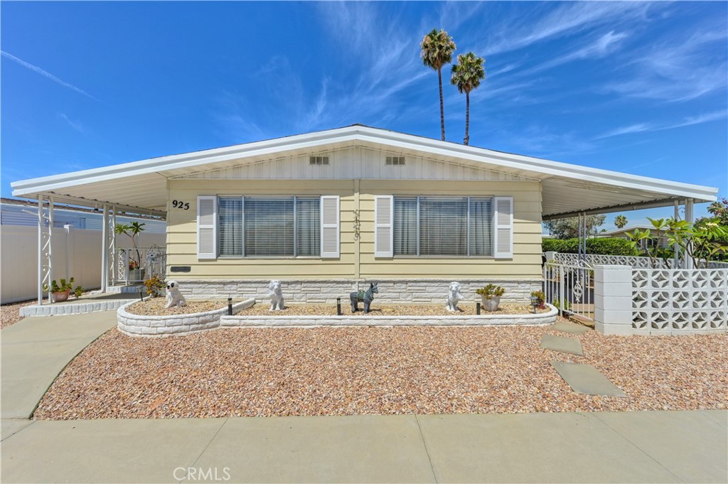 Welcome to Sierra Dawn Estates, a 55+ community where you own the land. This beautifully remodeled 2-bedroom, 2-bath home offers 1,488 sq ft of single-level living on a corner lot. Enjoy an open floor plan with new laminate flooring, recessed lighting, and an upgraded kitchen featuring quartz counter tops and soft-close cabinets. The spacious primary suite includes a tub, walk-in shower, and dual vanities. It has access to its own private porch for a great coffee in the morning or evening. Additional highlights include a sunroom, an indoor large laundry room with sink, next to storage area, and more! Newer roof, new fence, and central HVAC. Low HOA includes access to pools, spas, clubhouse, fitness center and much more! This house has it all. This home is well kept and move-in ready; close to shopping and medical facilities.
