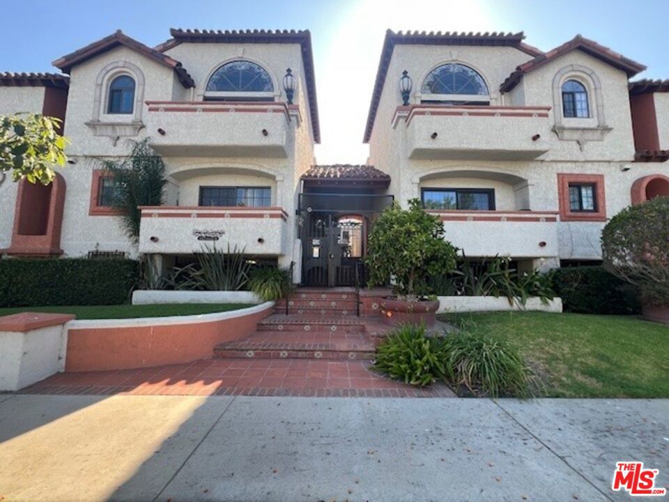 Welcome to this beautiful 2-bedroom, 2-bathroom corner unit in the highly desirable Mar Vista neighborhood. Set in a charming Spanish-style building, this home offers an inviting open-concept living and dining area, perfect for both everyday living and entertaining guests. The updated kitchen is equipped with stainless steel appliances, including a refrigerator, stove, microwave, and dishwasher, making it both stylish and functional. The bright and airy living room features large windows, a balcony that floods the space with natural light, and a decorative fireplace and built-in shelving for added charm. Additional features include recessed lighting, hardwood flooring throughout, ceiling fans in both bedrooms, and central heat and air for year-round comfort. The unit also comes with two assigned parking spaces in tandem within a controlled-access gated garage, common area laundry, and bicycle storage. Located just minutes from local shops, trendy restaurants, major freeways, UCLA, and the top-rated Mar Vista Elementary School, this condo combines comfort, convenience, and Westside charm. Don't miss out on this rare leasing opportunity, schedule your private showing today!