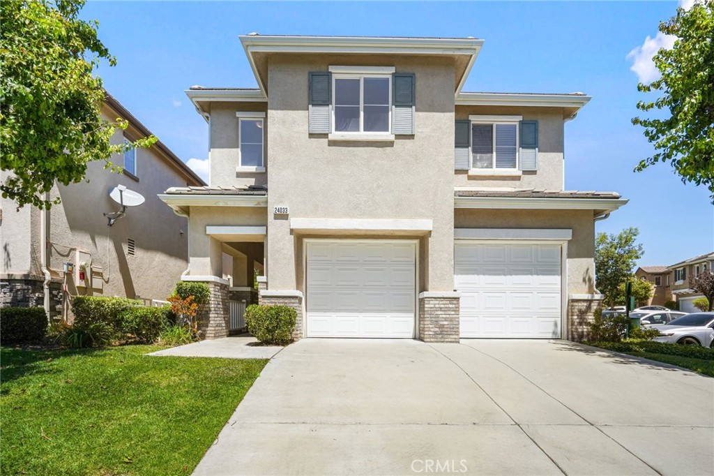 Welcome to this beautiful corner PUD home in the sought-after Tesoro Del Valle community of Valencia, built in 2004 and freshly painted throughout. Offering 4 spacious bedrooms and 2.5 bathrooms, this 2,039 sq ft home is filled with natural light and charm. Step inside to a formal living room with a cozy fireplace and soaring 20-foot ceilings, leading to a family/dining combo and a well-appointed kitchen with abundant cabinet space, granite countertops, and brand-new appliances including a microwave, stove, and dishwasher. The main level also features a convenient half bathroom, direct access to the 2-car garage, and a sliding glass door to a private, beautifully landscaped backyard. Upstairs you’ll find all 4 bedrooms, including a master suite with a large customized walk-in closet and a private bath featuring a walk-in shower, soaking tub, and dual sinks. Additional highlights include a laundry room with cabinets, spacious secondary bedrooms, and a hallway bath with granite countertops and a soaking tub. Enjoy low HOA fees of just $195 with resort-style amenities—2 pools, 2 spas, clubhouse, basketball court, tennis court, and plenty of guest parking. Conveniently located near restaurants, shopping, parks, and easy freeway access.