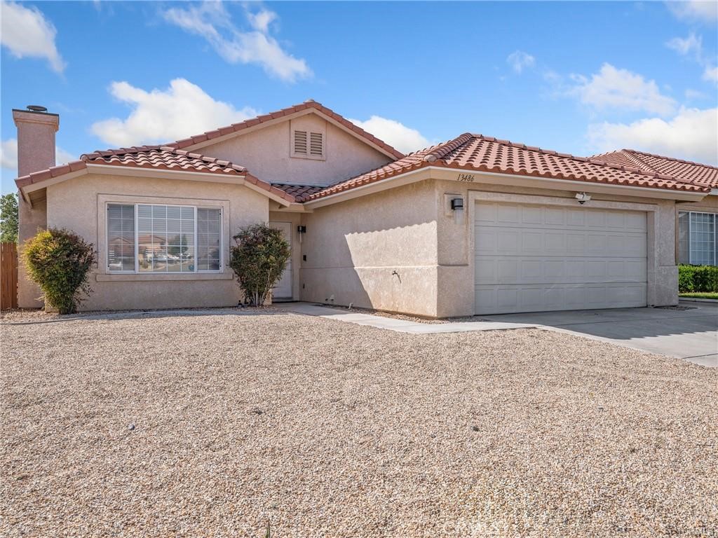 Come see this Lakeview Ridge Home with LOW HOA and PAID SOLAR! Has a ravine view and no neighbors in the back. SO Welcome to this charming and well-maintained home featuring 3 bedrooms and 2 bathrooms, nestled on a generous lot in the heart of Victorville. Step inside to an inviting open layout filled with natural light and stylish light wood flooring throughout. Enjoy the convenience of an indoor laundry area and a spacious 2-car garage. The backyard offers a covered patio on a solid slab—perfect for entertaining family and friends on those cool spring evenings. Whether you're relaxing under the patio or enjoying the ample yard space, this home has everything you need for comfort and convenience. Centrally located in Victorville near Spring Valley Lake, Victor Valley College, 15 freeway and shopping! Don’t miss this great opportunity—schedule your tour today!
