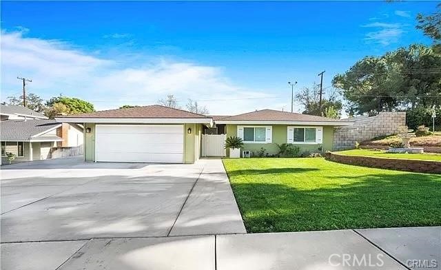 Welcome to this gorgeous 4-bedroom, 2-bathroom home, ideally situated in a desirable Riverside neighborhood.
Inside, you'll find a spacious and functional layout featuring a large family room, a separate living room with a cozy fireplace, and generous natural light throughout. Step outside to the backyard and enjoy the covered cinder block patio—perfect for outdoor dining, weekend barbecues, or simply unwinding in the shade. Additional highlights include RV parking and a detached 2-car garage, providing both convenience and ample storage.
Located close to local parks, schools, shopping centers, and major freeways, this home offers easy access to everything you need. Plus, you're just 7 minutes from the University of California, Riverside (UCR)