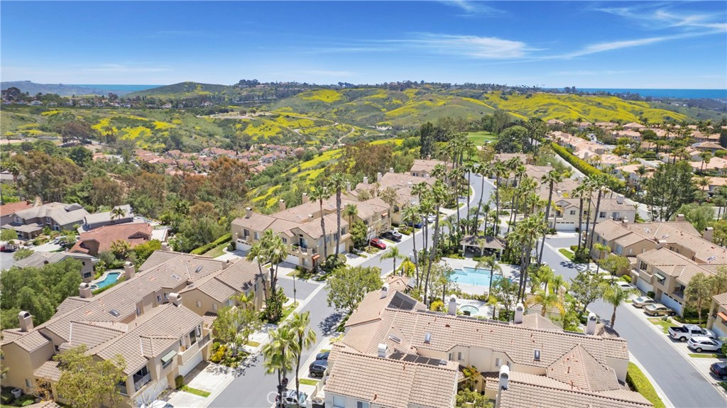 Nestled in the Heart of Laguna Niguel, you will find peace and serenity in the highly sought after and ocean close community of Encore in Marina Hills. The Jewel of Laguna Niguel! Owner has spared no expense and completely remodeled the home! New Mohawk vinyl plank flooring installed throughout the home, complemented by newer Milgard windows that enhance both energy efficiency and aesthetic appeal. The kitchen has recently been remodeled with new pure Quartz Tahoe Blue countertops & reverse osmosis water filtration. Kitchen also features a metal graphite farm sink paired with a modern touchless faucet, combining style with convenience. Both bathrooms have been tastefully remodeled, featuring new vanities, granite countertops, dual sinks and beautifully updated stonework in the showers. All soft close drawers and cabinets. This home also features recessed lighting with LED lights and all electrical for the tv's has been tucked into the wall. Oversized 2 car garage with shelving and epoxy flooring! This property features one of the largest driveways in the community, perfect for accommodating family gatherings and guest parking! The Marina Hills Community clubhouse offers a full-kitchen and fireplace adjacent to the pool area, a 75 ft. Junior Olympic size swimming pool, wader pool, spa, showers and restrooms. There are barbeque areas, 6 tennis courts and pickleball courts. A walking path off Parc Vista leads down to Salt Creek Trail by which you can walk all the way to Salt Creek Beach. Marina Hills Park has soccer fields, basketball courts, bocce ball courts, picnic tables and a play structure. Conveniently located near shopping, dining, hiking and biking trails, public and private schools, local beaches and the harbor.