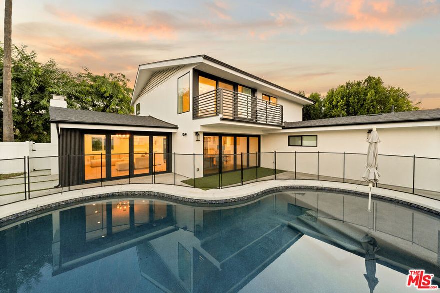 Step into refined living at 15655 Castlewoods Dr, where timeless elegance meets modern sophistication in an idyllic Sherman Oaks location. From the moment you arrive, striking curb appeal and lush surroundings set the stage for a residence designed to impress. This beautifully appointed residence showcases soaring ceilings, expansive windows, and seamless indoor-outdoor flow that elevates everyday living. The gourmet kitchen is a true showpiece, featuring sleek cabinetry, premium appliances, and designer finishes, perfect for both intimate dinners and grand entertaining. The two primary suites are nothing short of sanctuaries, each offering spa-level luxury, designer baths, and a calming, retreat-like ambiance. A private balcony invites sunrise reflections and sunset toasts, while the oversized walk-in closet and spa-inspired bath, with soaking tub, dual vanities, and a picture-window shower, create an elevated daily escape. Additional bedrooms offer versatility for family, guests, or a chic home office. Every detail throughout has been thoughtfully upgraded, blending style with function. Outdoors, a private backyard retreat awaits with lush landscaping and a spacious patio designed for effortless entertaining or tranquil escapes. Nestled in a prestigious neighborhood with easy access to upscale shopping, dining, and top-tier schools, this home embodies the best of comfort and luxury. A rare offering in Royal Woods, this remarkable residence captures the essence of Southern California living, luxury, lifestyle, and spectacular views beyond compare. Minimum 670 credit score.