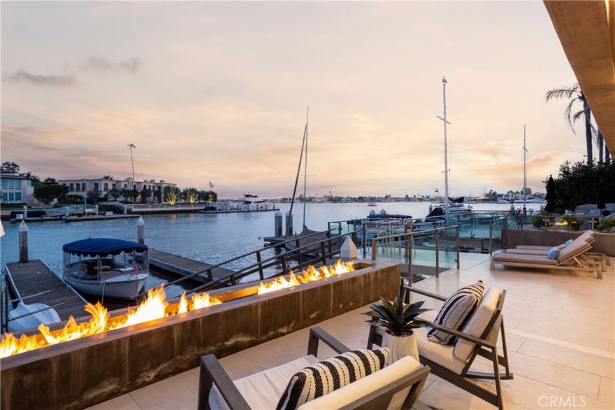 Located in the exclusive guard-gated enclave of Linda Isle, this contemporary waterfront home boasts 45 feet of prime bay frontage with breathtaking views of Newport Harbor’s main turning basin. The sleek entry gate opens to a private courtyard with a sparkling pool and spa, setting the stage for effortless indoor-outdoor living.  Spanning 3,336 sq. ft., the home features an open-concept layout with three bedrooms, four-and-a-half bathrooms, and two fireplaces. The expansive bayside great room flows seamlessly to a waterfront patio with a fire pit, perfect for entertaining. The luxurious primary suite offers stunning harbor views and an expansive sitting area.  A private dock accommodates a 60’ yacht plus two side ties, inviting you to embrace Newport’s premier boating lifestyle. As one of only 107 residences in Linda Isle, this home offers exclusive community amenities, including a clubhouse, tennis court, and private beach.  Experience the best waterfront living in one of Newport Beach’s most coveted communities.