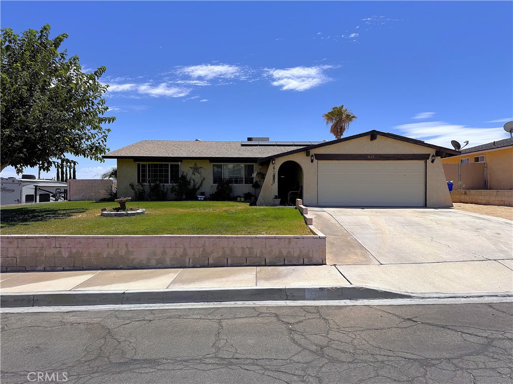 This beautifully maintained four-bedroom, two-bath home in Barstow features a popular floor plan with living area in the middle of the home and three bedrooms on one side and primary en-suite on the other. It has a wonderful curb appeal with green landscaping that brings a renewed spirit to the desert. The roof, flooring. exterior paint and ,appliances are just a few years old. It has central heating and cooling and 14 paneled solar to help alleviate the cost of staying cool. The backyard is fenced with a covered patio barbecue area and there is a storage shed. This neighbor has retained its desirability through the years, having a very active Neighborhood Watch and being close to schools and shopping. With the access of the I -15 freeway on one side and the I -40 on the other side. It is less than one minutes from the famous Inland Empire Stater Brothers, grocery store, and about five minutes from super Walmart.