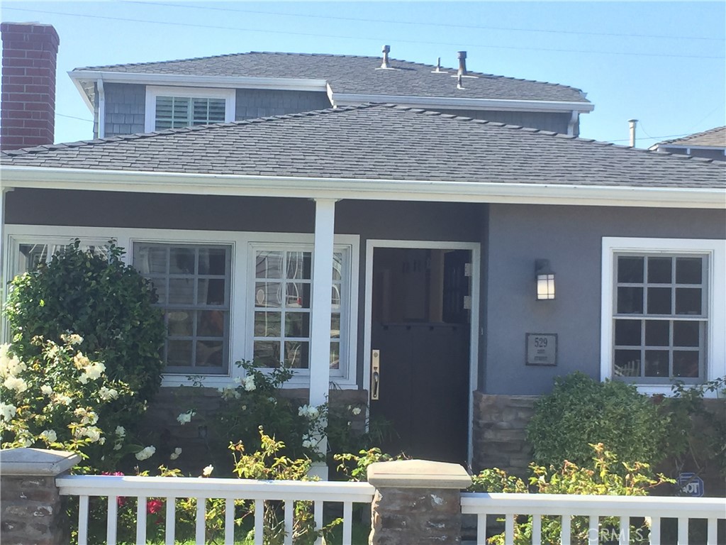This 4 bedroom 3 bath home has been renovated. The tasteful home has high end finishes and has excellent flow with a large kitchen and great room that opens to the eating area and a nice front grassy yard. There's a formal dining room, a large bedroom and a full bath downstairs along with a two car garage with an additional parking space and an alley that is action packed with kids playing hoops and games galore during the fun filled weekends. The upstairs has 3 bedrooms and 2 bathrooms including a large master bedroom with a walk in closet and a private balcony overlooking a peaceful courtyard that is great for the neighborhood BBQ. This is the ultimate neighborhood..... 4 blocks to the beach, 6 blocks to downtown, 3 blocks to Grandview elementary and right across the street you'll find the famous "live oak" park with tennis, baseball and basketball. This street offers a great sense of community that is difficult to duplicate. This home has stainless appliances, custom cabinets and beautiful hardwood floors as well as many extras including AC that you need to see to appreciate.